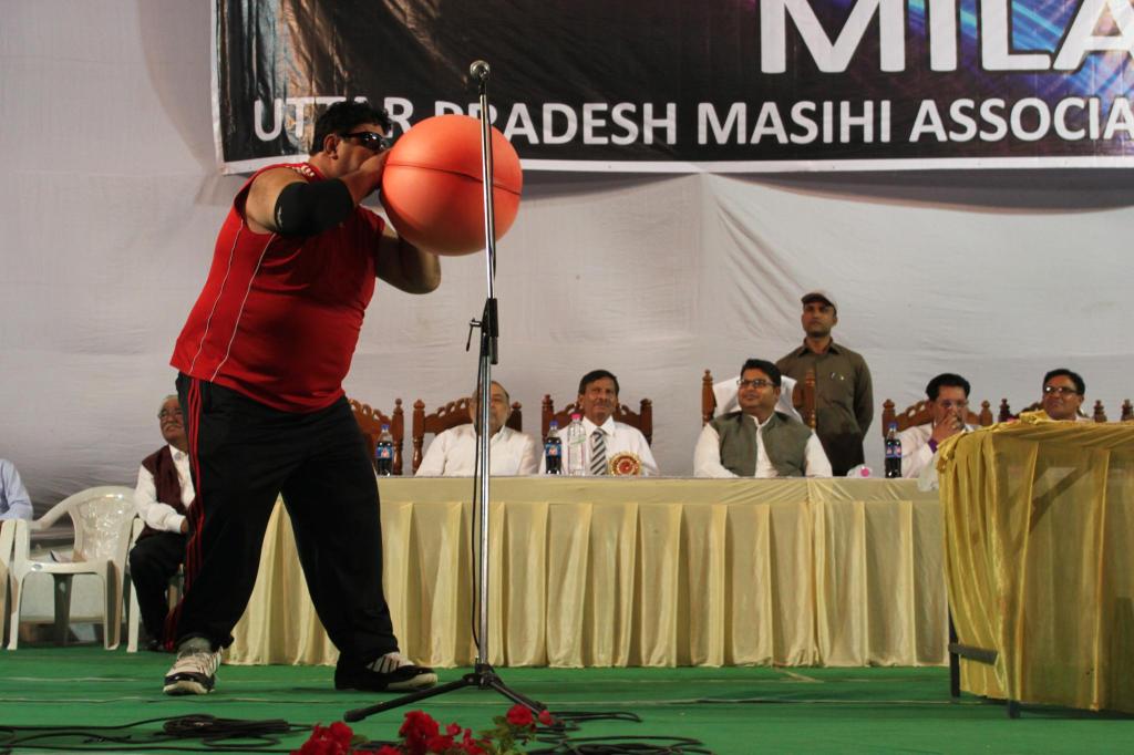 Manoj blows a hot-water bottle bag up like a balloon Photo by Sonia Paul.