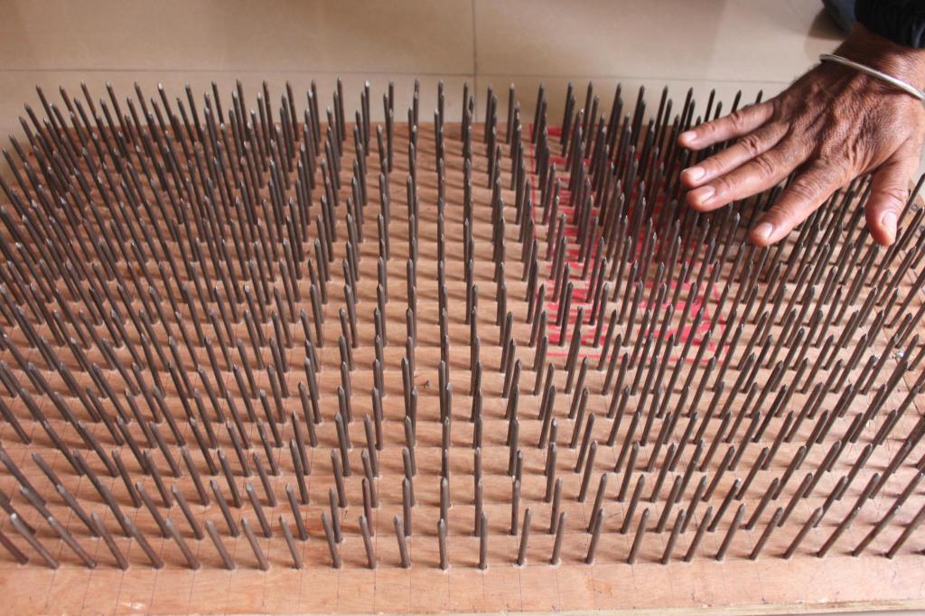A bed of nails that Manoj can lie down on to demonstrate how to bear pain - one of his stunts. Photo by Sonia Paul.
