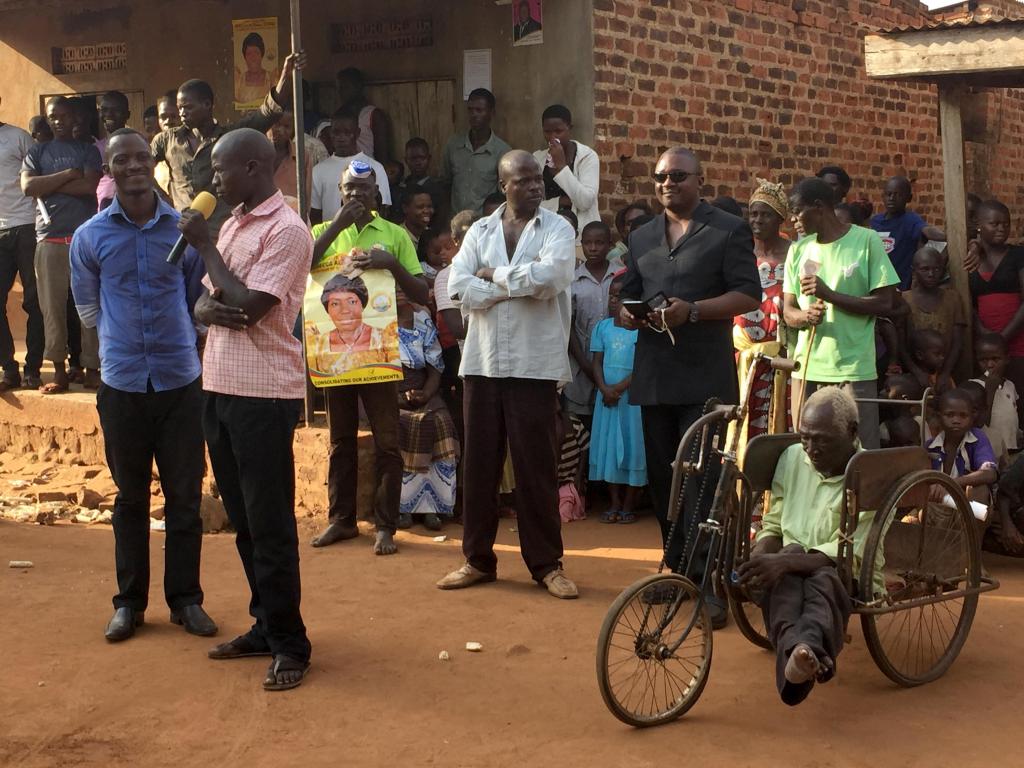 A disabled villager (right) waits for his turn to address Rebecca Kadaga during one of her campaign stops in Kamuli district. Photo by: Sonia Paul