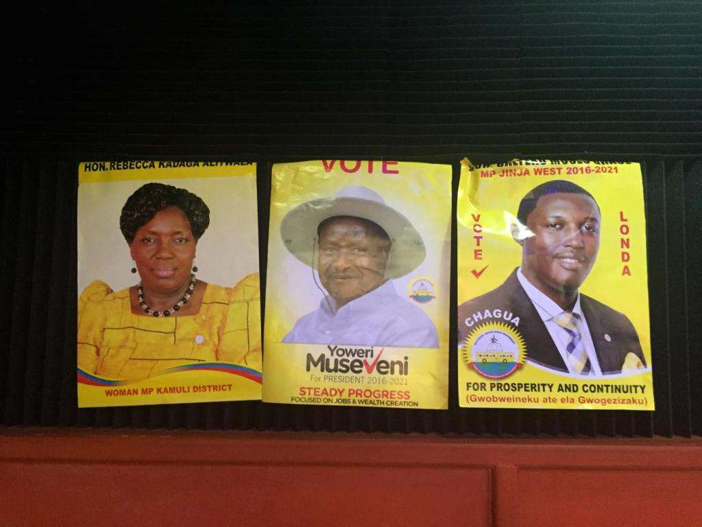 Campaign posters for politicians of the National Resistance Movement, Uganda’s ruling political party, adorn the walls of a radio station in Jinja, a district in eastern Uganda, Feb. 6, 2016. Yoweri Museveni, center, is the president of Uganda and has just won his fifth term as president in the country’s most recent elections. Photo: Sonia Paul