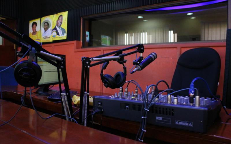 Inside the recording studio of one of numerous radio station in Uganda. Here, yellow posters featuring candidates of the ruling NRM party are affixed to the walls. (Sonia Paul/Foreign Affairs)